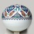  <em>Spherical Hanging Ornament</em>, 1575–1585. Ceramic; fritware, painted in black, cobalt blue, green, and red on a white slip ground under a transparent glaze, 12 3/4 × 11 3/4 × 11 1/4 in. (32.4 × 29.8 × 28.6 cm). Brooklyn Museum, Gift of Mr. and Mrs. Frederic B. Pratt, 43.24.8. Creative Commons-BY (Photo: Brooklyn Museum, 43.24.8_view1_PS9.jpg)