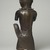 Edo. <em>Figure of a Hornblower (Ikpakohẹn)</em>, ca. 1504–50. Copper alloy, iron, 24 1/2 x 8 1/2 x 6 in. (62.2 x 21.6 x 15.2 cm). Brooklyn Museum, Gift of Mr. and Mrs. Alastair B. Martin, the Guennol Collection, 55.87. Creative Commons-BY (Photo: Brooklyn Museum, 55.87_back_PS11.jpg)