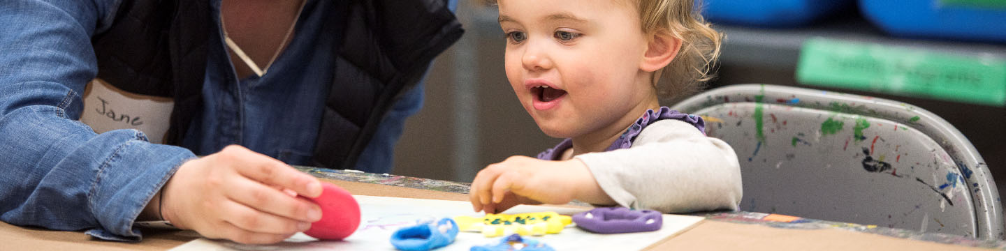 Young child making art